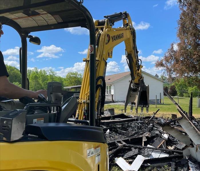 Excavator with building materials