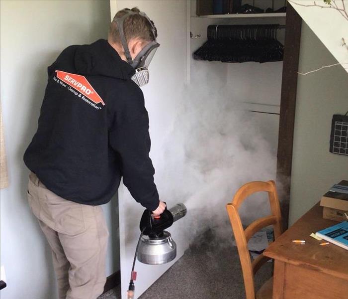 Crew Member Thermal fogging a closet