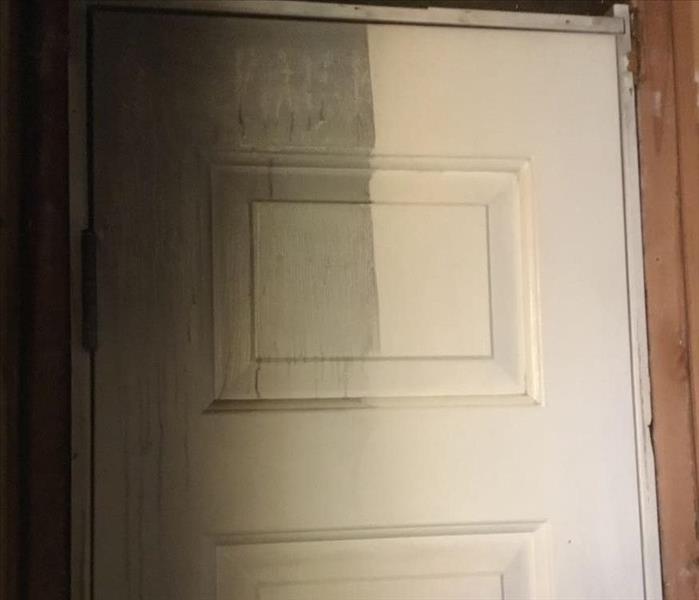 door with soot on half of the door
